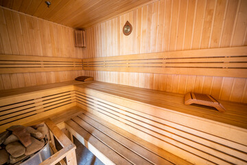 Fototapeta na wymiar The interior of a Finnish sauna, a classic wooden sauna