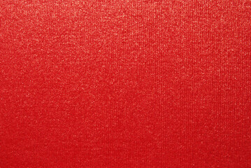 Red color ribbed cardboard texture with golden glitter effect