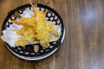 Shrimp fried, tempura and sweet sauce for dipping. Japanese culture food. Tempura Jumbo Shrimps with salad and salsa dip on white plate 