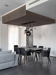 Modern dining room with table, the chairs are made of leather