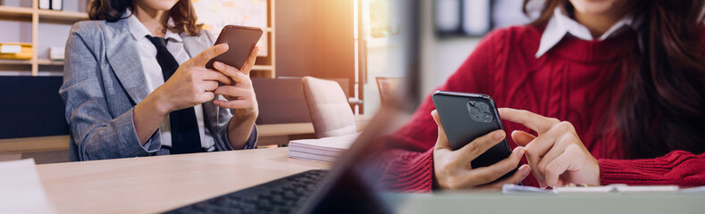 Businessman and team analyzing financial statement Finance task. with smart phone and laptop and tablet. Wealth management concept