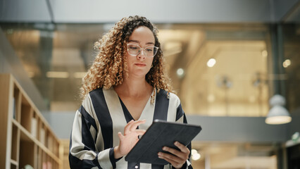 Female Data Analyst Smiling While Checking New Data for the Day. Portrait of hispanic Businesswoman...