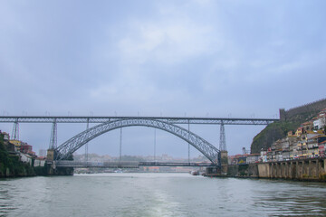 Fototapeta na wymiar Bridge that overlooks the beautiful Douro River in the heart of Portugal