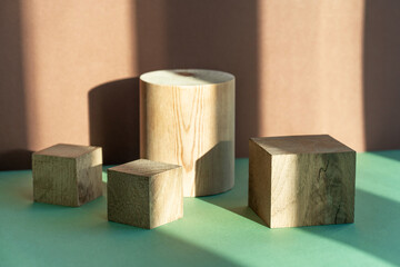 Beautiful pastel background made of natural materials of a geometric shape of a tree for the presentation of your product. Composition from an empty wooden podium.