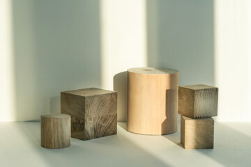 Beautiful pastel background made of natural materials of a geometric shape of a tree for the presentation of your product. Composition from an empty wooden podium.