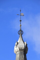 Historic Building Spire with Weather Vane Close Up In Amsterdam, Netherlands