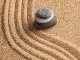 Fototapeta na wymiar Japanese Zen stone garden - relaxation, meditation, simplicity and balance concept - pebbles and raked sand tranquil calm scene