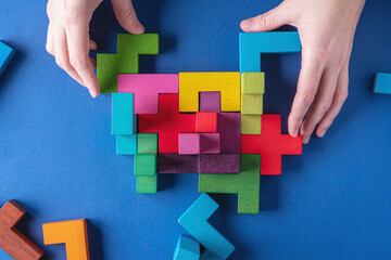 Concept of decision making process, logical thinking. Background with colorful shapes wooden blocks