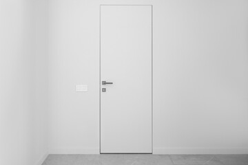White flush doors on a white wall