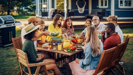 Parents, Children, Relatives and Friends Having an Open Air Vegetarian Dinner in Their Backyard. Old and Young People Talk, Chat, Have Fun, Eat and Drink. Garden Party Celebration in a Backyard. - obrazy, fototapety, plakaty