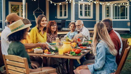 Group of Multiethnic Diverse People Having Fun, Communicating with Each Other and Eating Vegetarian Meals at an Outdoors Dinner. Relatives and Friends Gathered Outside Their Home on Warm Summer Day. - Powered by Adobe