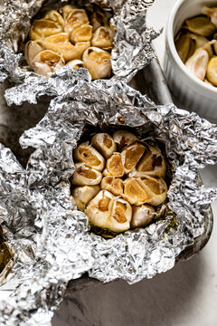 Home baked garlic cloves in baking foil