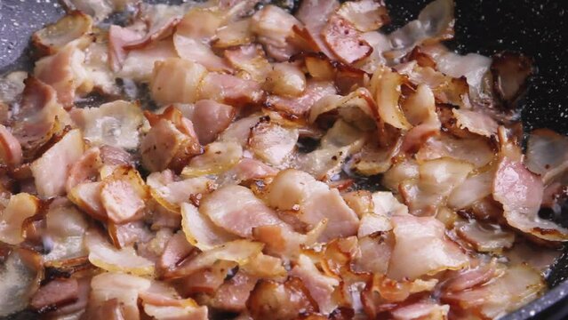 Cut the smoked bacon into strips and fry until golden brown