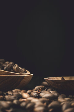 Fresh pecans and broken shells on a rustic wooden background