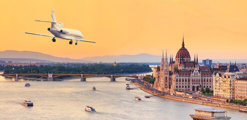 City summer landscape, panorama, banner - top view of the historical center of Budapest with a flying airplane during sunset, in Hungary