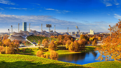 Autumn cityscape - view of the Olympiapark or Olympic Park and Olympic Lake in Munich, Bavaria, Germany - obrazy, fototapety, plakaty