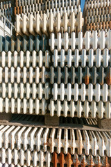 Heavy duty radiators. Old stacked scrap panel radiators. Iron ecycling radiators in scrap dealers site.