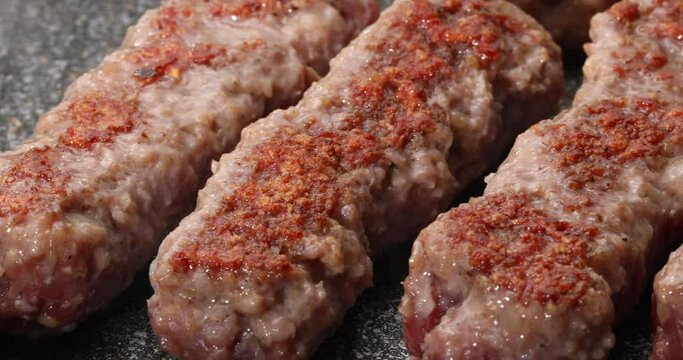 Raw minced meat sausages grilled. National balkan food preporation.
