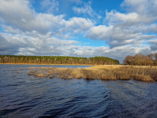 Fototapeta premium lake in winter with beautiful clouds in the blue sky