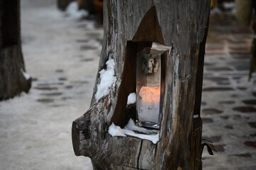 Country style outdoor lighting in a wooden log