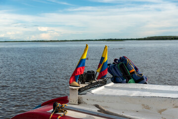 Obraz premium Life jackets on the roof of a public transport boat on the Magdalena River.