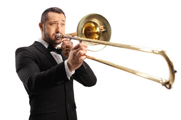 Young man playing a trombone - obrazy, fototapety, plakaty