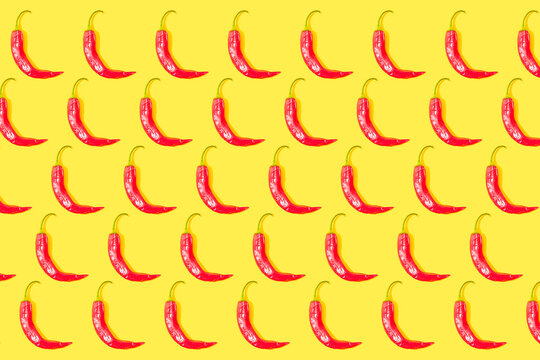Chilli peppers pattern on yellow background