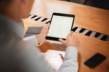 Close up of man using digital tablet.