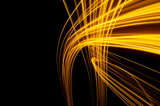 Abstract modern banner design. Glowing warm lines on black background. High quality photo