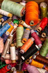 A box with multicolored coils of different threads in close-up
