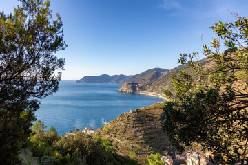 Small touristic town on the coast and farmland, Manarola, Italy. Cinque Terre. Sunny Fall Season day.