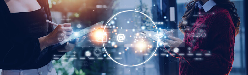 Contact us or Customer support hotline people connect. Businessman using a laptop and touching on virtual screen contact icons ( email, address, live chat, internet wifi ).