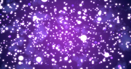 Abstract bright glowing festive purple circles with blur effect and energy magical bokeh on purple background. Abstract background