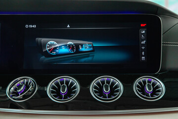 multimedia screen and ventilation system in famous expensive premium car close-up