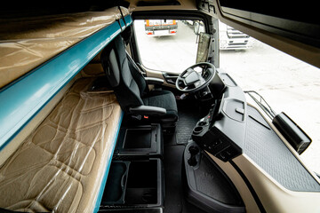 view of the cab of the new truck from the inside with a berth