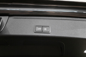 Obraz na płótnie Canvas Car trunk open button. Electric trunk switch controller. Car trunk electric lock button