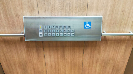 The disabled elevator button or panel with braille code of the elevator lift.
