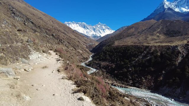 Dingboche, Nepal: Point of view footage of an hiker walking the trail toward Everest base camp between Pangboche and Dingboche along the Imjla Khola river