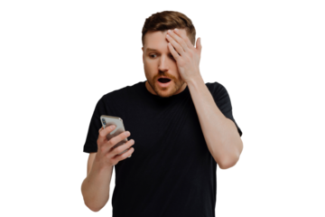 Impressed guy reading unexpected news in social media on smartphone with amazed expression