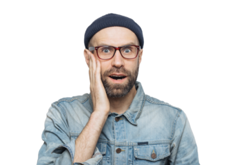 Portrait of amazed bearded excited male looks with surprisment in camera, recieves unexpected news, dressed in fashionable clothing, has attractive look, isolated over white studio background