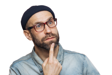 Close up shot of thoughtful bearded male with blue eyes being deep in thoughts, looks pensively into distance, ponders about something, isolated over pink background. Attractive man poses indoor