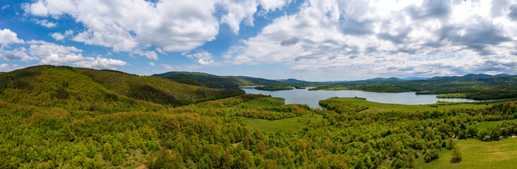 Amazing huge aerial panorama from to green countryside and a lake