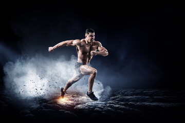 Obraz na płótnie Canvas Male runner against dark background