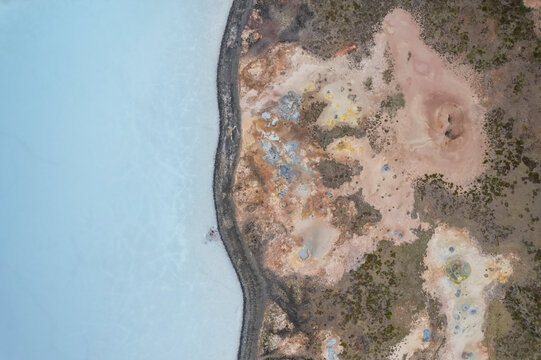 Aerial view of a coastline along the lakefront at Gunnuhver Hot Springs (Geo Thermal Hot Spring), Grindavík, Iceland.