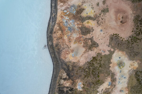 Aerial view of a coastline along the lakefront at Gunnuhver Hot Springs (Geo Thermal Hot Spring), Grindav&iacute;k, Iceland.