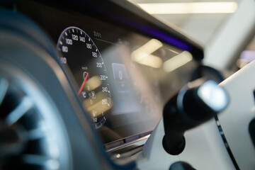 mechanical speedometer and LCD screen in a luxury car