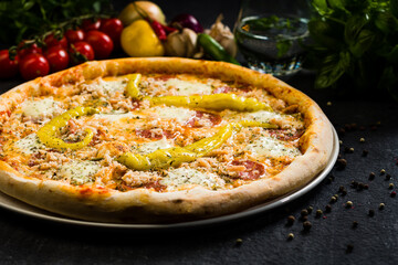 Pizza with salami, mozzarella and green peppers