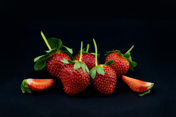 close-up strawberry fruit on black background