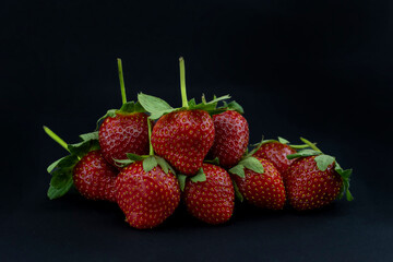 close-up strawberry fruit on black background