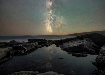 Milky Way Galaxy reflections in a tide pool near Otter Point Overlook in Acadia National Park,...